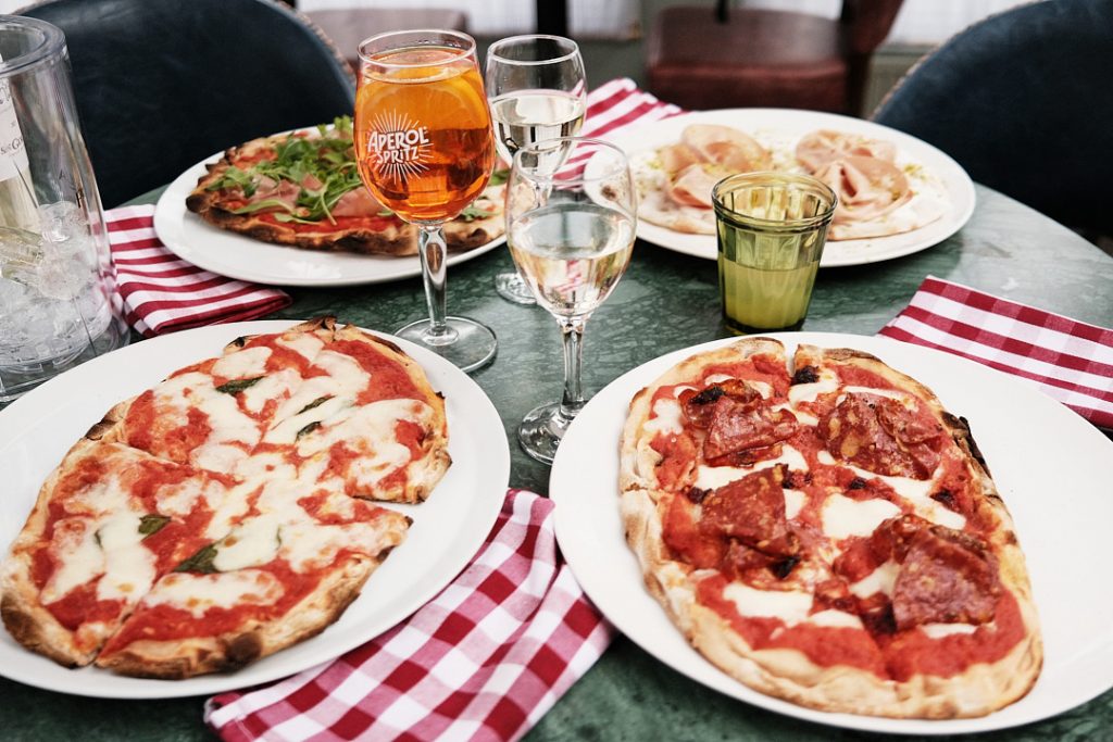 Pizzas on Table with Drinks | Tavola Pizzas on Table with Drinks